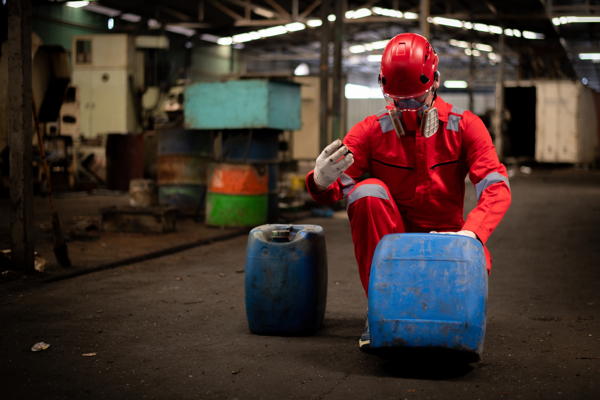 Worker or scientist industry wearing protective safety uniform, white glove and gas mask under clean